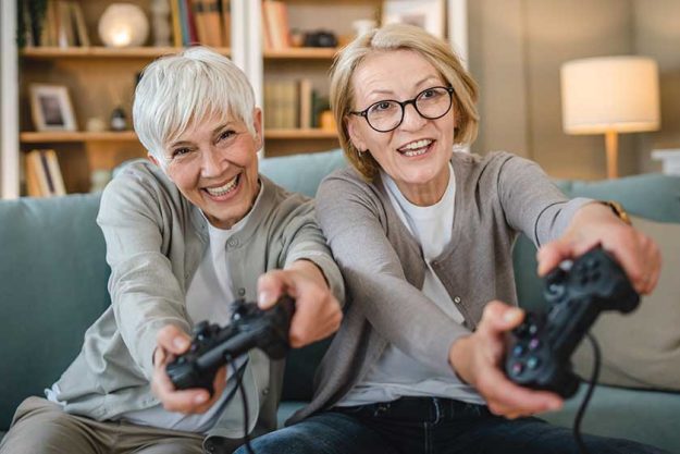 Two senior women Playing Game