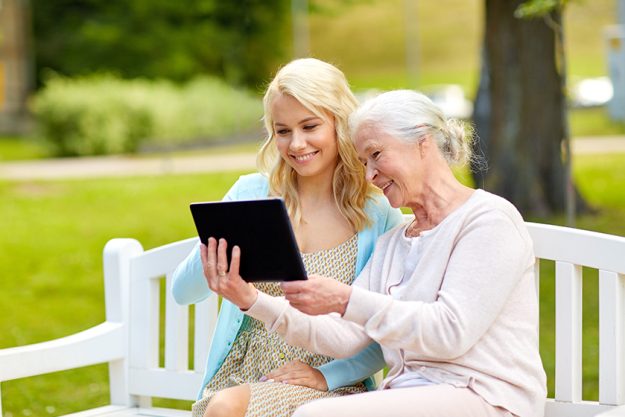 Daughter and senior mother with tablet pc Daughter and senior mother with tablet pc