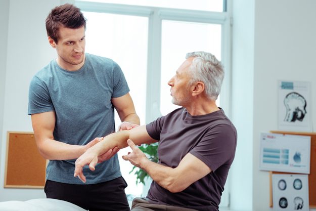 Handsome young man listening to his patient Handsome young man listening to his patient