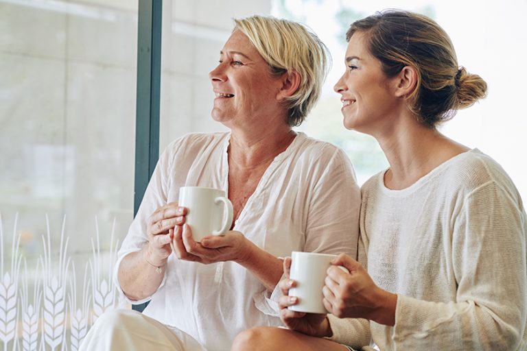 Happy middle-aged woman and her adult daughter Happy middle-aged woman and her adult daughter