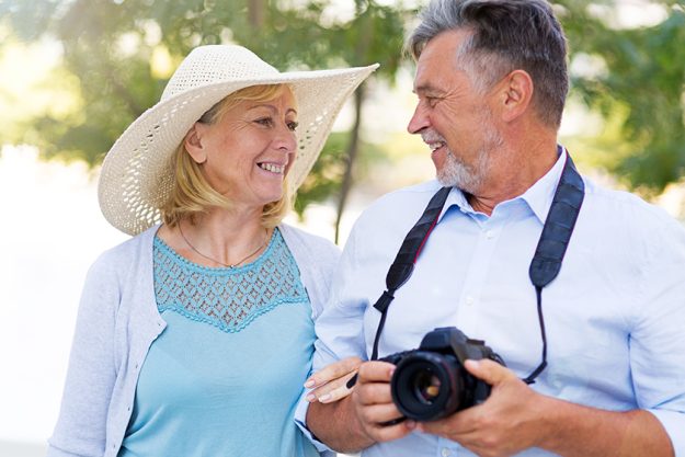 Mature couple with digital camera