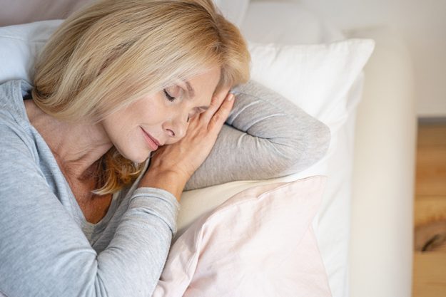 Pleased face of sleeping woman