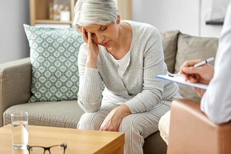 Sad senior woman patient and psychologist Sad senior woman patient and psychologist