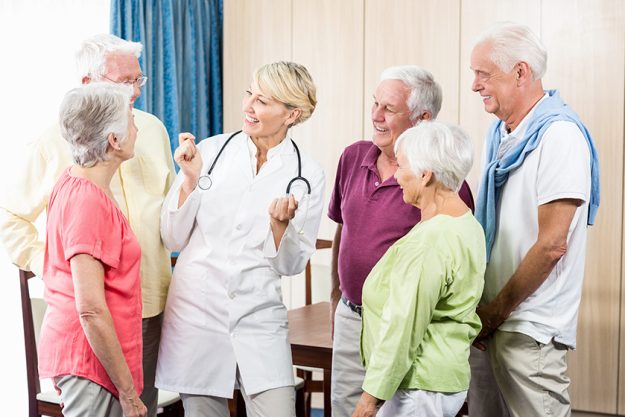 Seniors looking at nurse Seniors looking at nurse