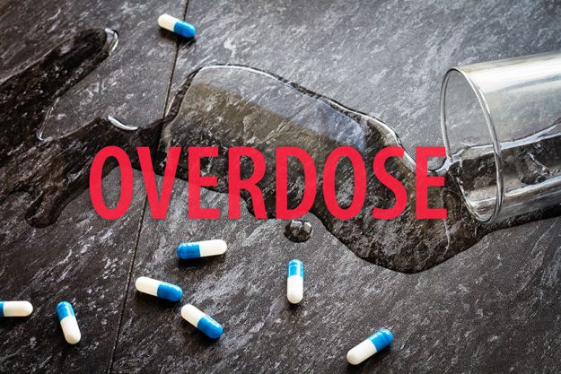 Water is spilled and medical capsules are scattered