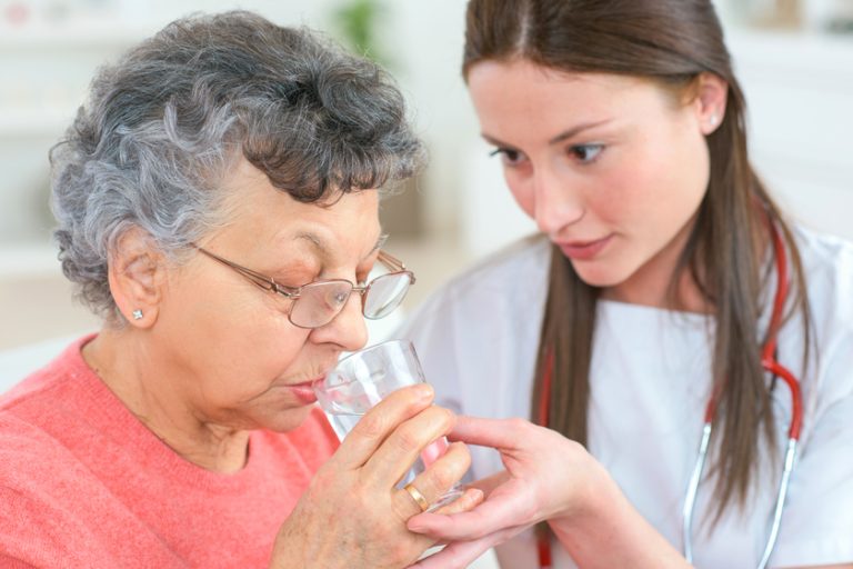 caregiver with and old woman Dry Mouth In Seniors: 4 Remedies You Can Try