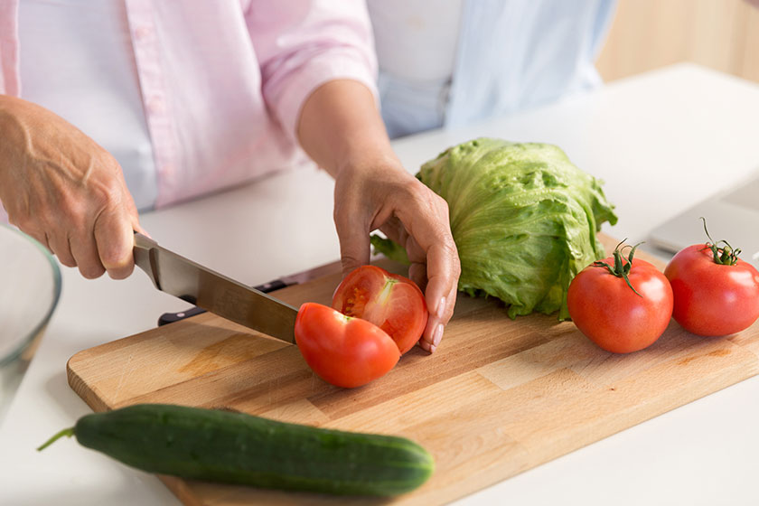 Cropped picture of mature loving couple family cooking