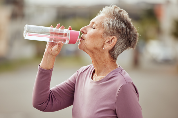 senior woman drinking water