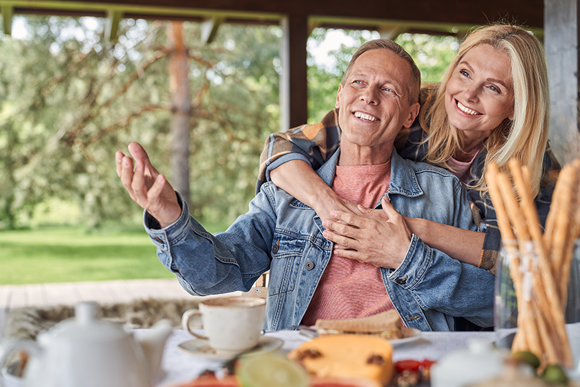 Joyful woman embracing husband