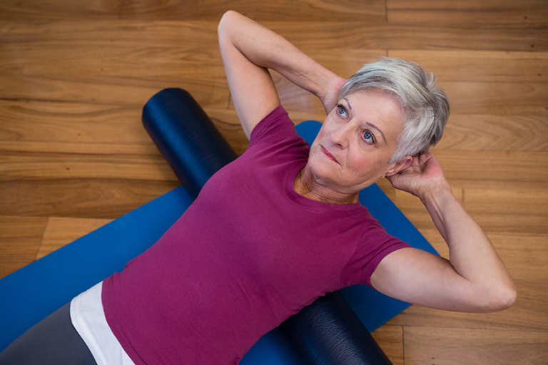 Senior woman performing stretching exercise