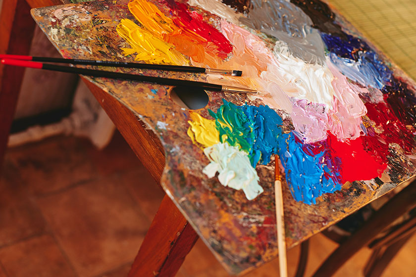 Artist palette with paint brushes Artist palette with paint brushes