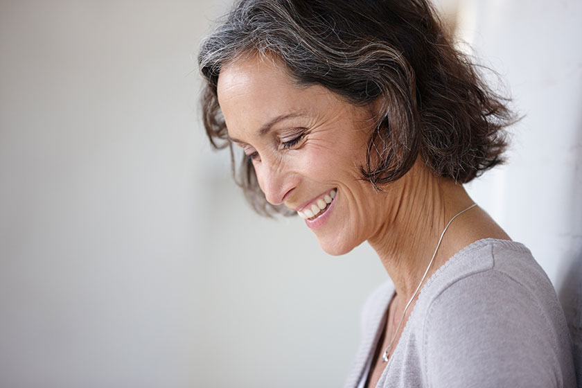 Loving my life. an attractive mature woman leaning wall Loving my life. an attractive mature woman leaning wall