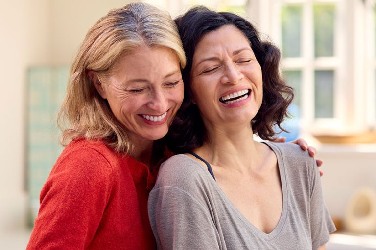 Loving Same Sex Mature Female Couple Hugging Loving Same Sex Mature Female Couple Hugging