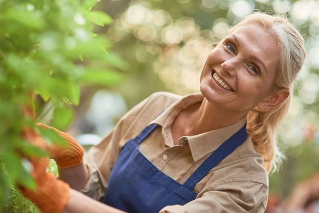 Middle aged caucasian business woman in garden