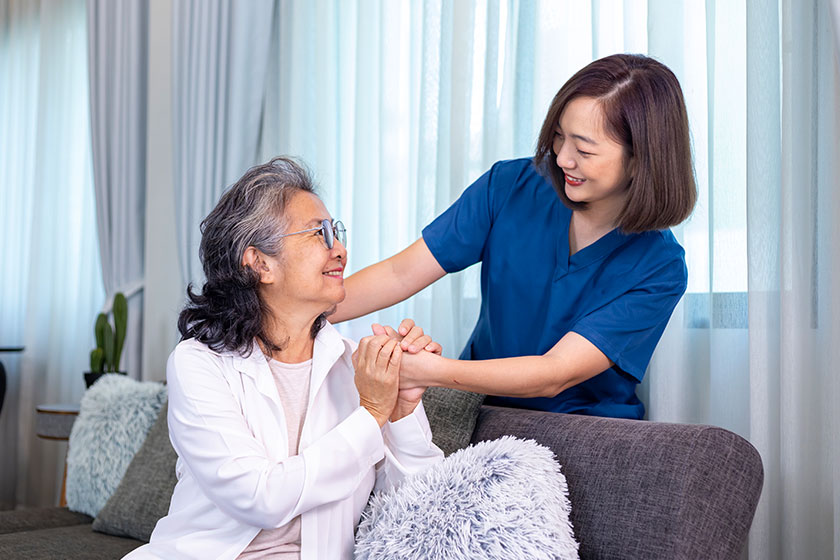Senior woman get medical service visit from caregiver nurse home Senior woman get medical service visit from caregiver nurse home
