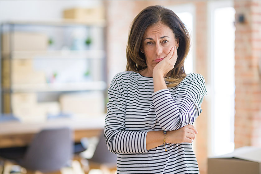 Beautiful middle age senior woman standing thinking looking tired bored Beautiful middle age senior woman standing thinking looking tired bored