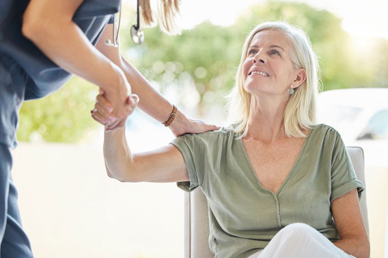 Closeup of an unrecognizable doctor offering their patient support recovery