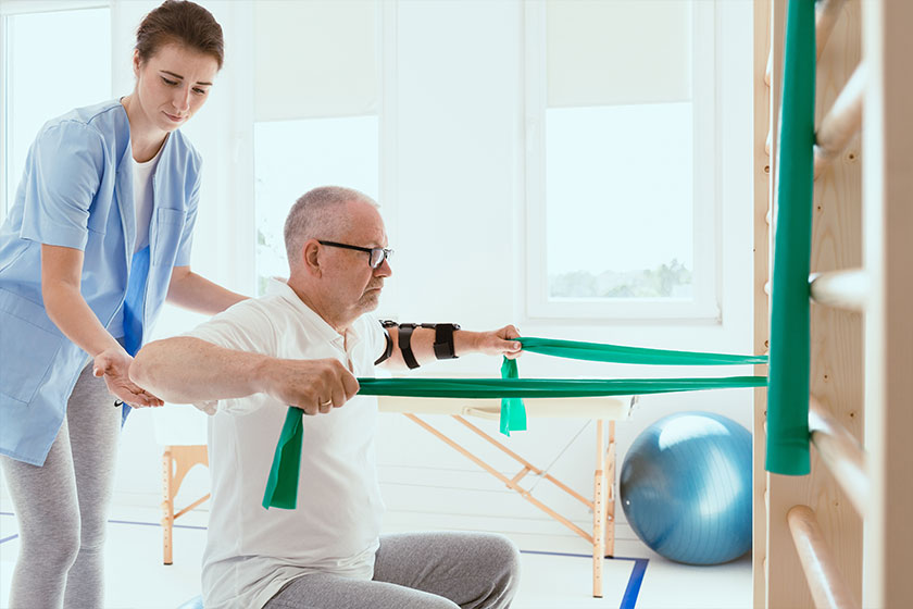 Elderly man doing gymnastic exercises
