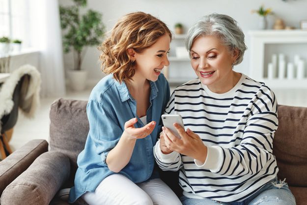 Happy senior woman smiling and sharing data