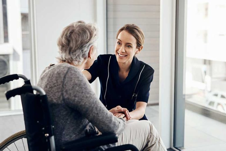 Its my job to check up on her. a female nurse caring for a senior woman in a wheelchair Its my job to check up on her. a female nurse caring for a senior woman in a wheelchair