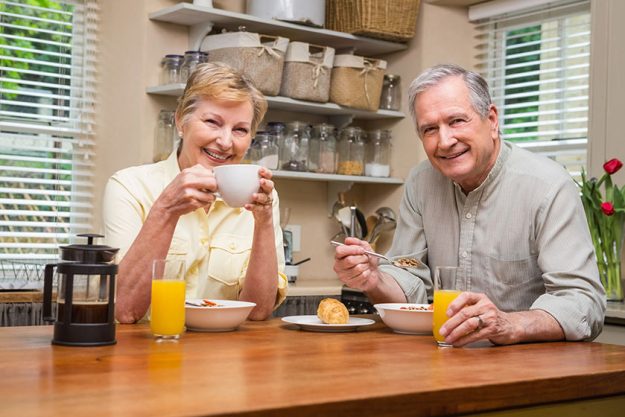 Senior couple having breakfast together