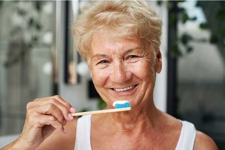 Senior woman about to brush her teeth Senior woman about to brush her teeth