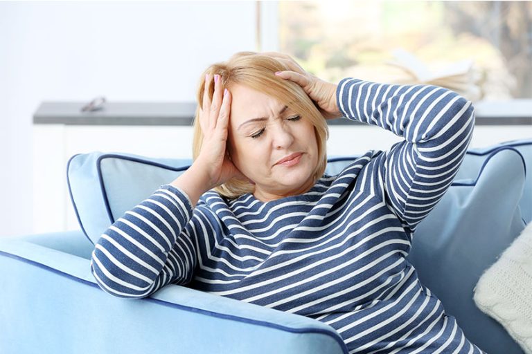 Senior woman suffering from headache Senior woman suffering from headache