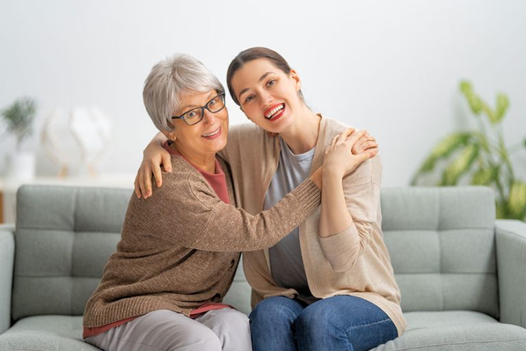 A portrait of small girl with grandmother hugging A portrait of small girl with grandmother hugging