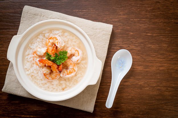 Porridge or boiled rice soup with shrimps bowl Porridge or boiled rice soup with shrimps bowl