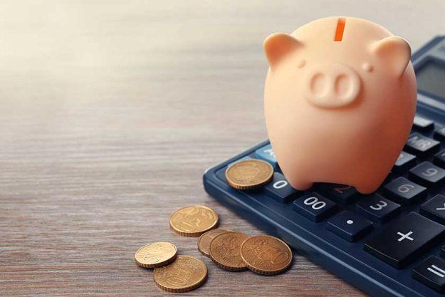 Beige piggy bank with coins Beige piggy bank with coins