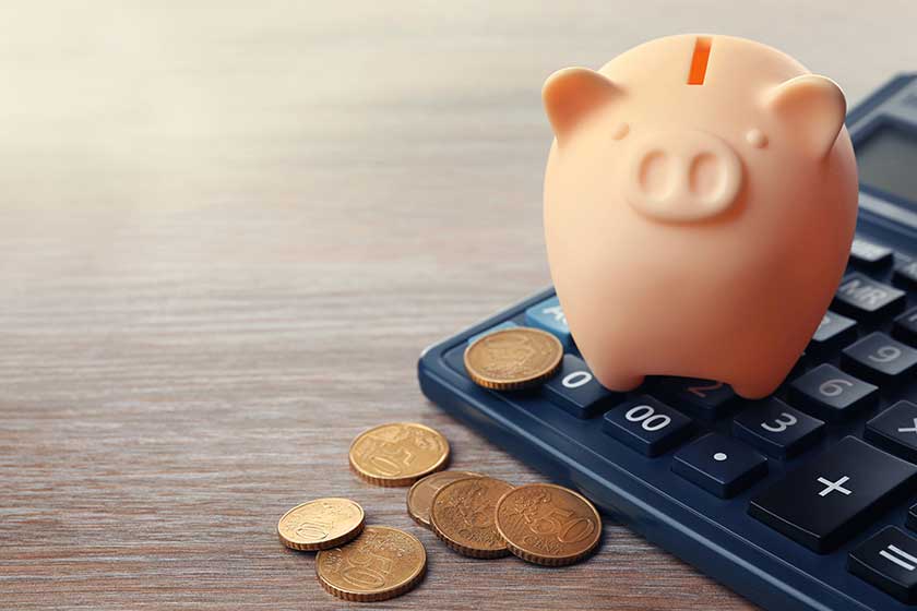 Beige piggy bank with coins Beige piggy bank with coins