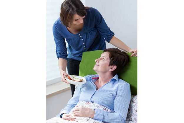 Girl giving grandma apple