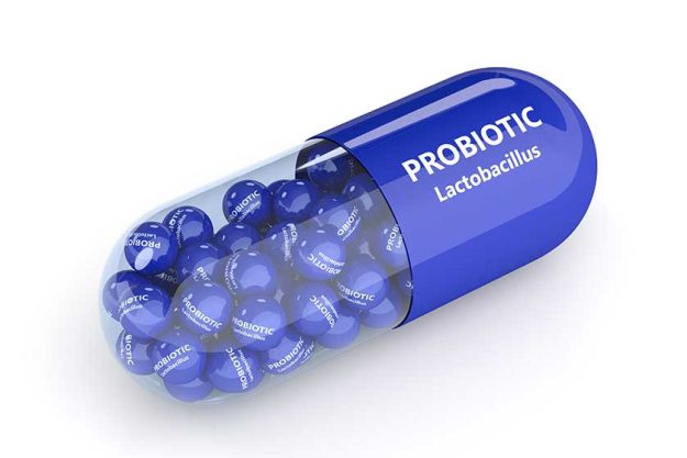 3d render of probiotic pill with granules over white 3d render of probiotic pill with granules over white