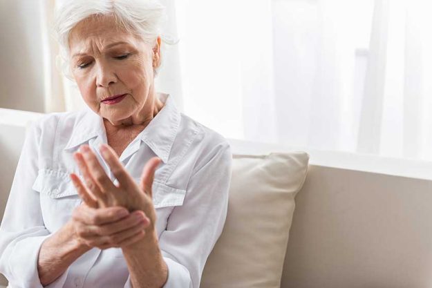 Elderly lady is enduring strong ache Elderly lady is enduring strong ache