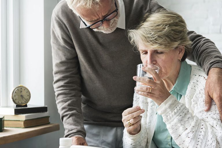 Senior Adult Taking Pills