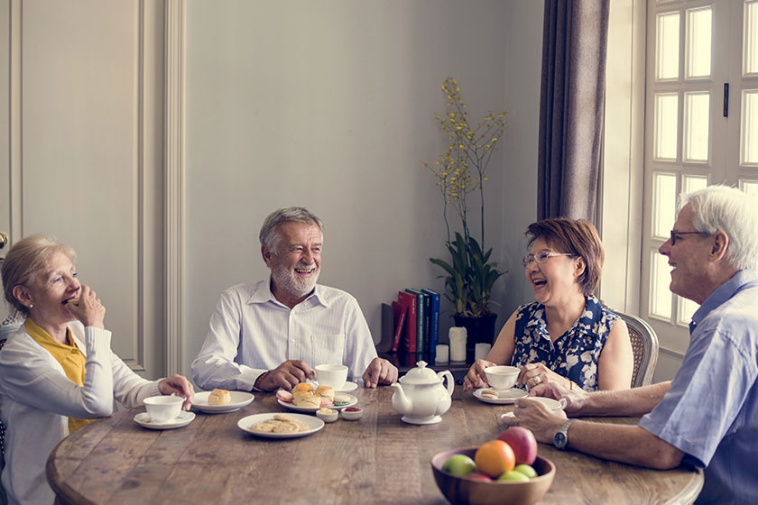 Senior people having tea break