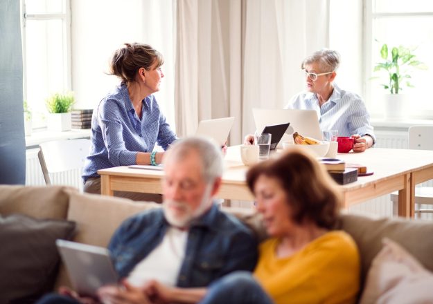 Group,Of,Senior,People,Using,Laptops,And,Tablets,In,Community
