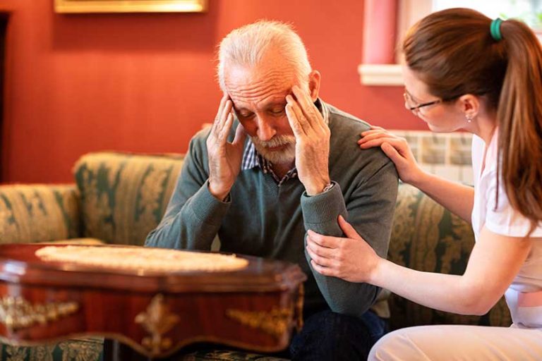 Loving-nurse-talking-senior-man-making-physical-contact Loving-nurse-talking-senior-man-making-physical-contact