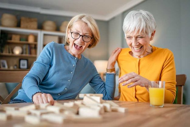 Two-senior-women-female-woman-friends-family-sisters-play-leisure