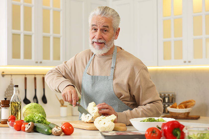 happy-man-cutting-cauliflower happy-man-cutting-cauliflower