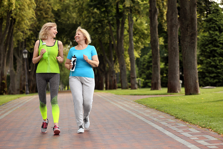 sporty-mature-women-training-park