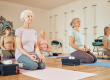 yoga-lotus-group-senior-women-gym-meditating