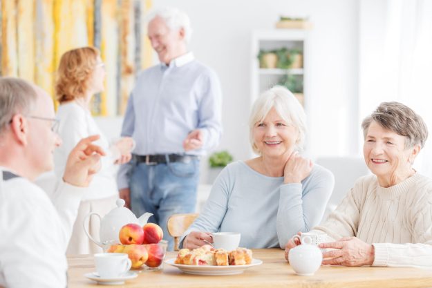 Happy,Senior,People,Spending,Afternoon,Together,At,Nursing,Home,Sitting