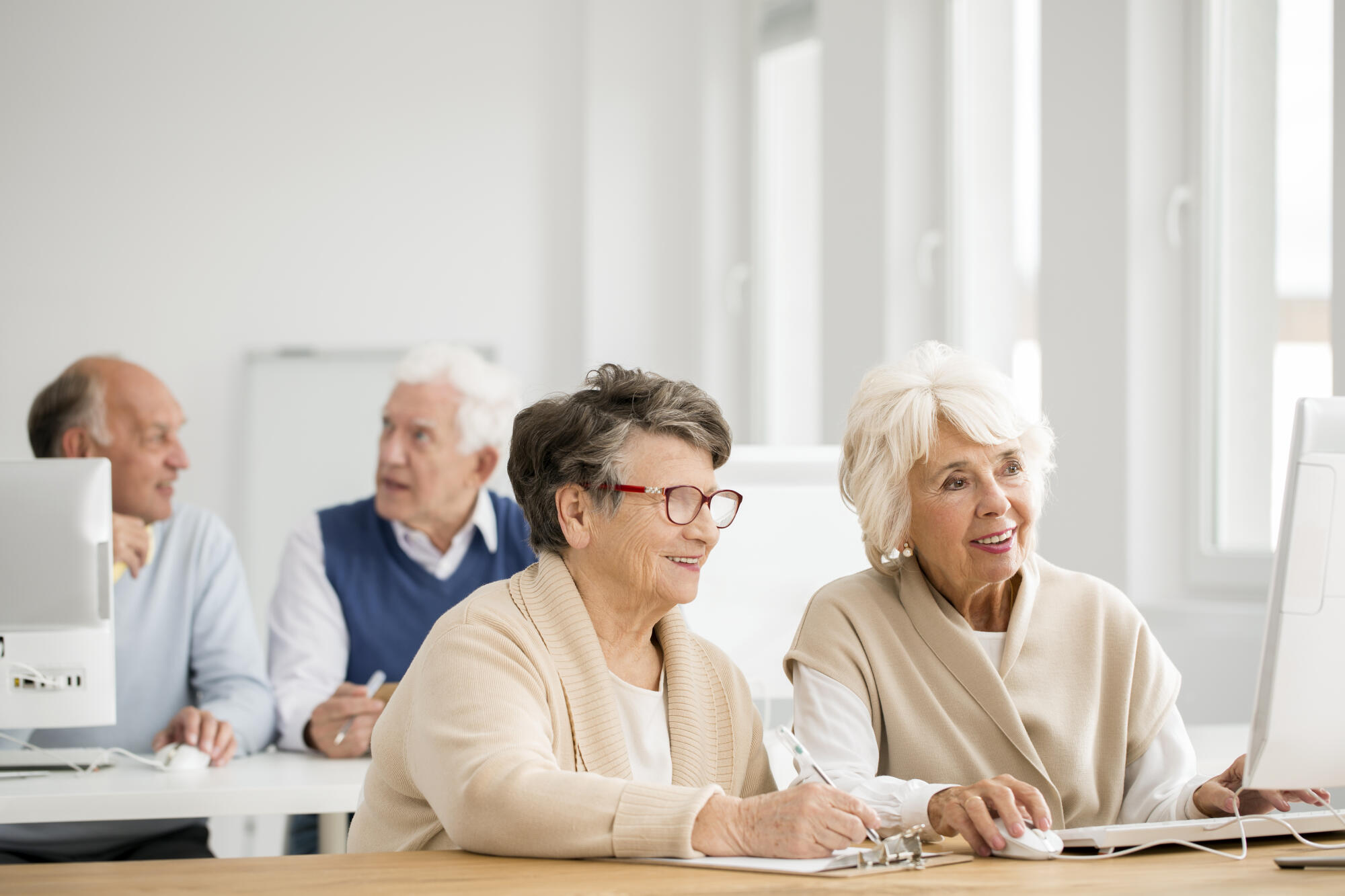 Two,Older,Women,Practicing,Using,Computer,Together
