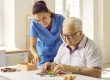 Friendly caregiver or nurse in the retirement home