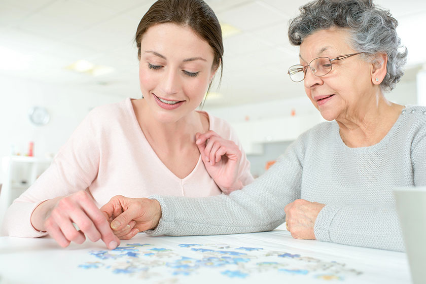 Granddaughter solving puzzle Granddaughter solving puzzle