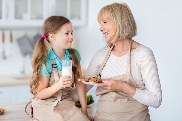 Grandma Feeding Cute Little Girl Grandma Feeding Cute Little Girl