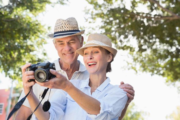 Happy senior couple looking at their camera