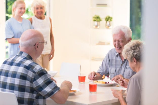 Senior-people-eating-dinner-wh