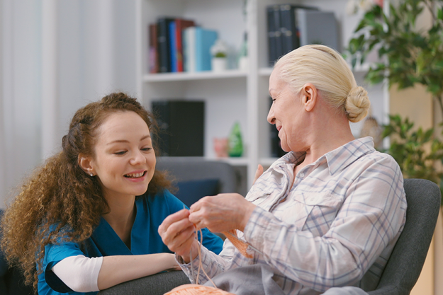 friendly-nurse-checking-senior-woman